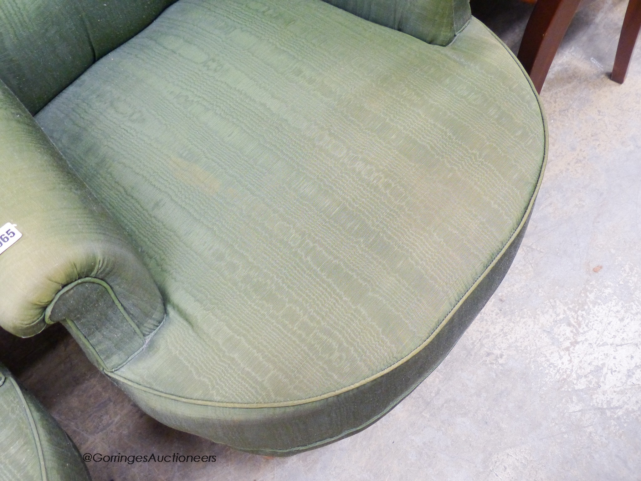 A pair of Victorian style armchairs upholstered in green moire silk.